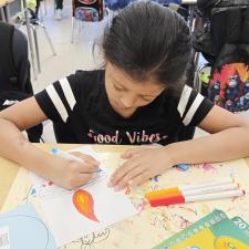 Student working on diya art