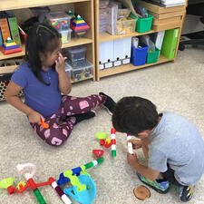 Students working on numeracy centers