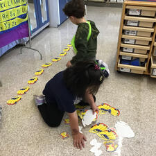 Students working on numeracy centers