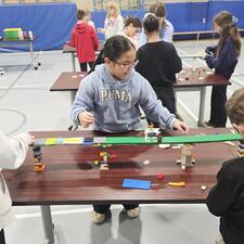 Students working on a Lego challenge presented by Brick Connections