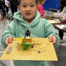 Students working on a Lego challenge presented by Brick Connections